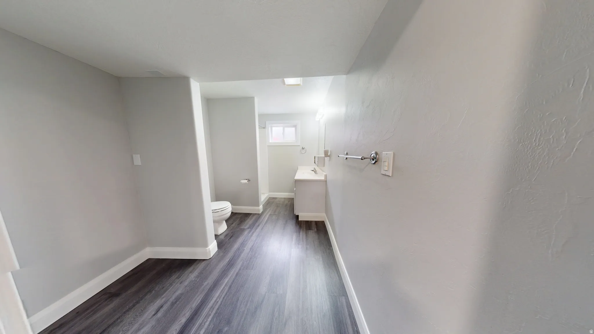 Bathroom with vanity and dark wood finished floors