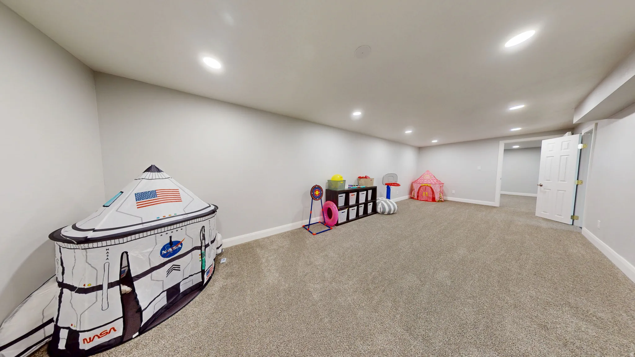 Rec room featuring light colored carpet and recessed lighting