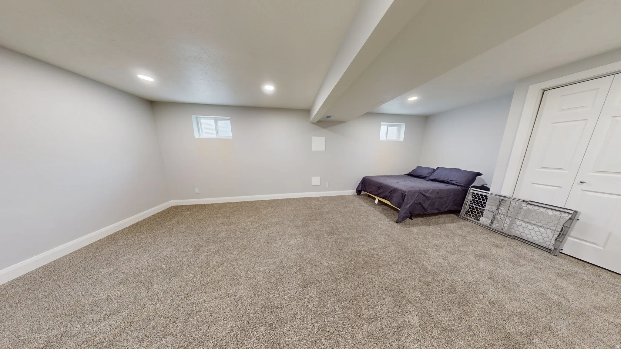 Unfurnished bedroom featuring carpet floors, recessed lighting, and a closet