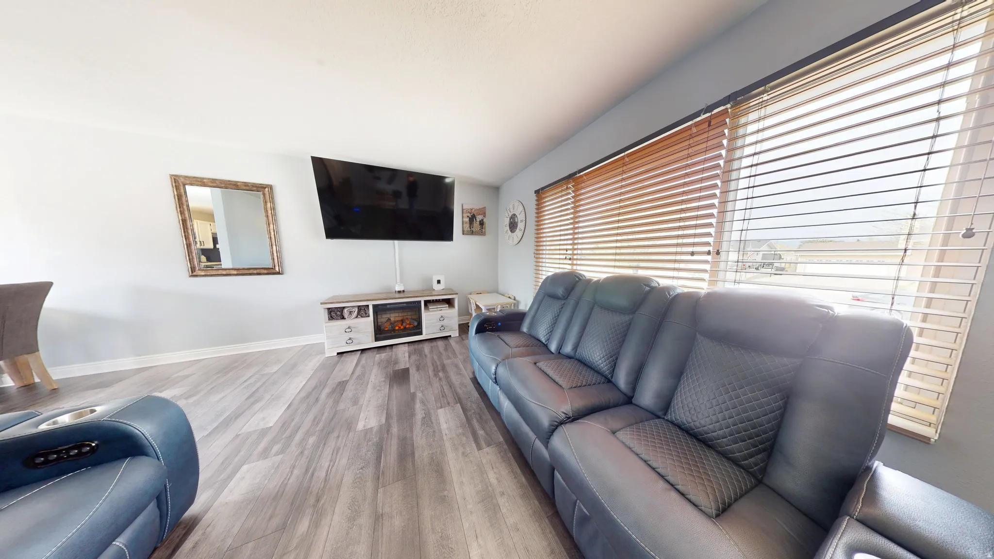 Living room featuring wood finished floors and baseboards