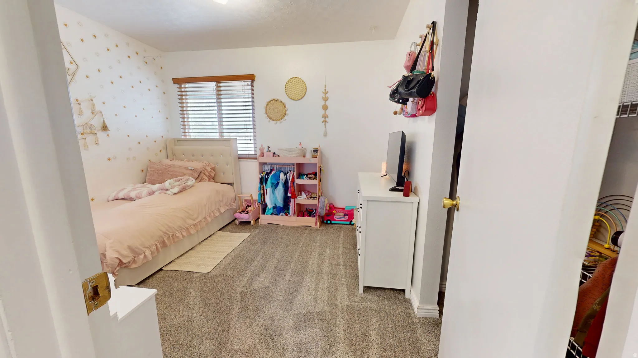 Bedroom with light colored carpet