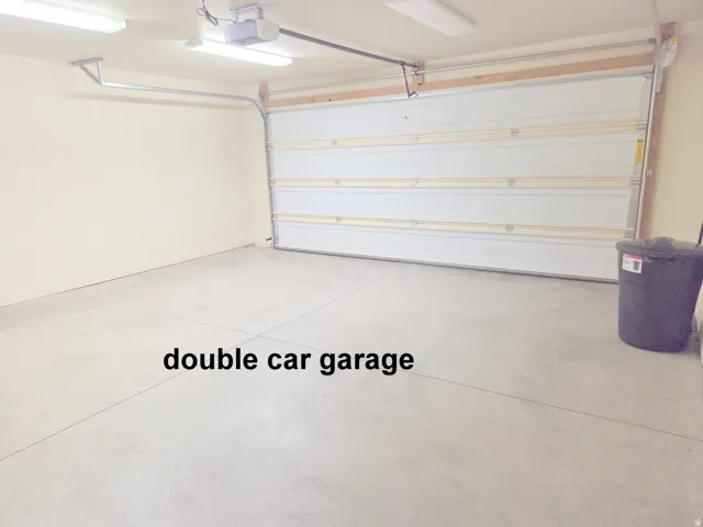 2 car garage featuring a garage door opener
