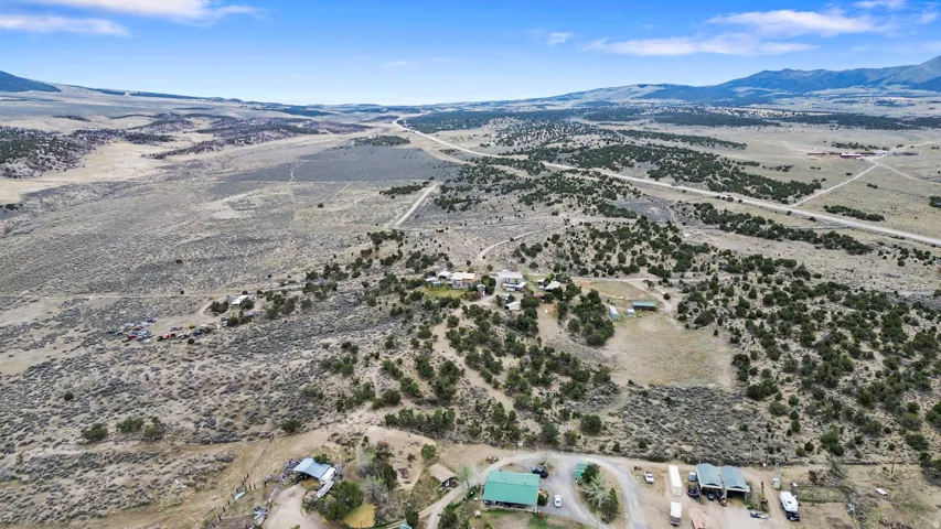 View of rural area with a mountainous background and a desert landscape