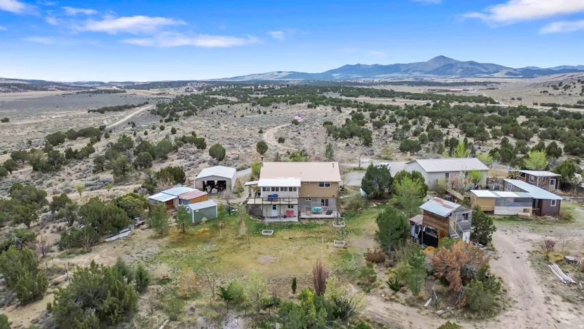 View of rural area with a mountainous background and a desert landscape