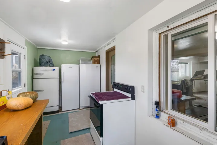 Laundry area with plenty of natural light and concrete flooring