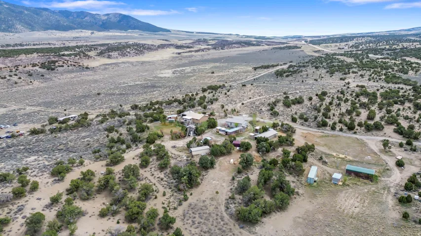 Overview of rural landscape with a desert landscape and a mountainous background