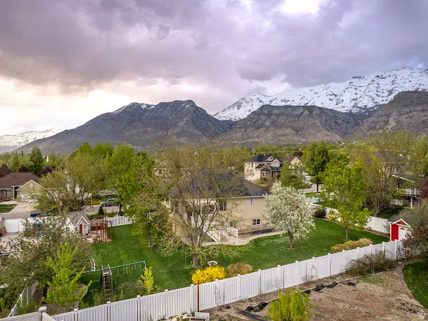 View of mountain backdrop with nearby suburban area