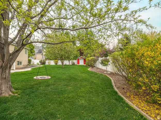 Fenced backyard with a shed