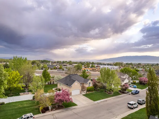 Aerial perspective of suburban area with a mountain backdrop