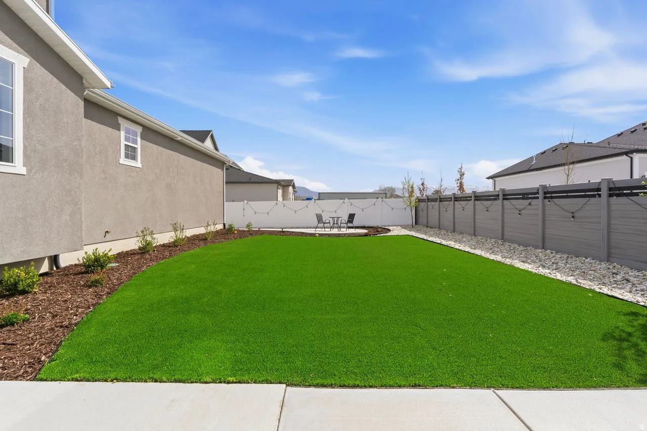 Fenced backyard featuring a patio area