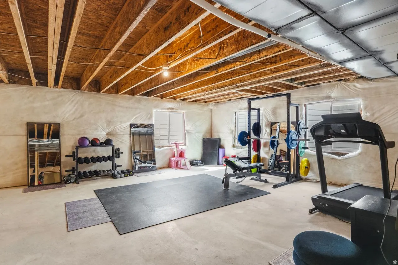 Exercise room featuring concrete floors