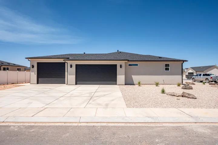 Contemporary ranch-style exterior with a two-tone stucco finish