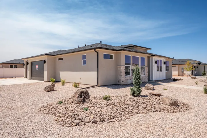 Contemporary stucco exterior featuring a stone accent façade