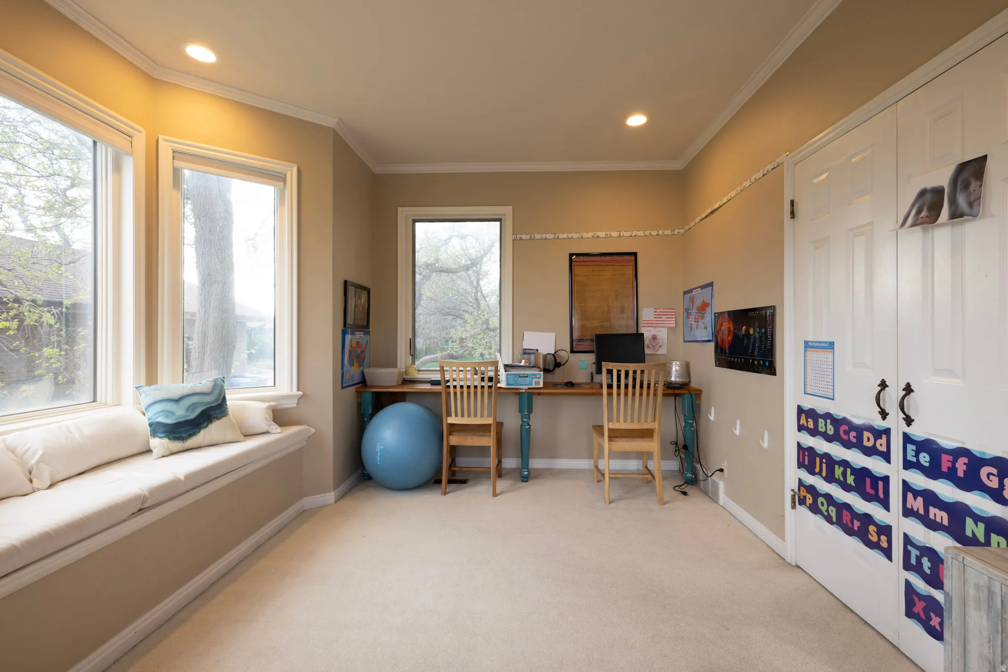 Home office featuring ornamental molding and recessed lighting