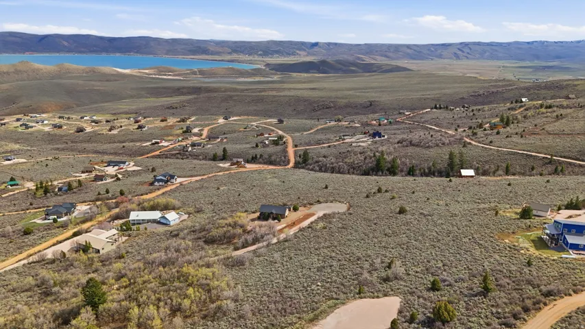 Aerial view of property's location with mountains and a desert landscape