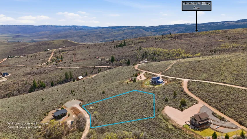 Overview of rural landscape featuring property parcel outlined and a mountain backdrop