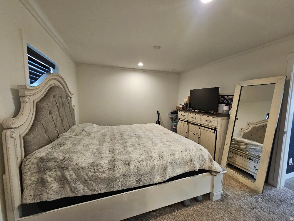 Master Bedroom with ornamental molding and recessed lighting