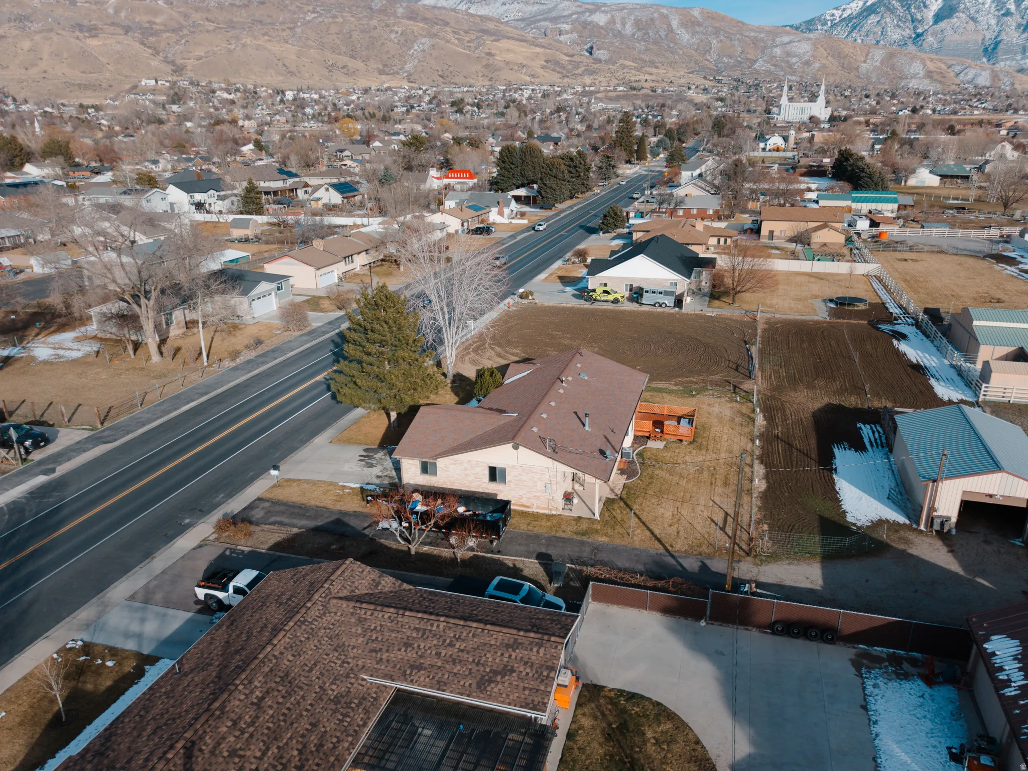 Aerial view of residential area featuring a mountainous background