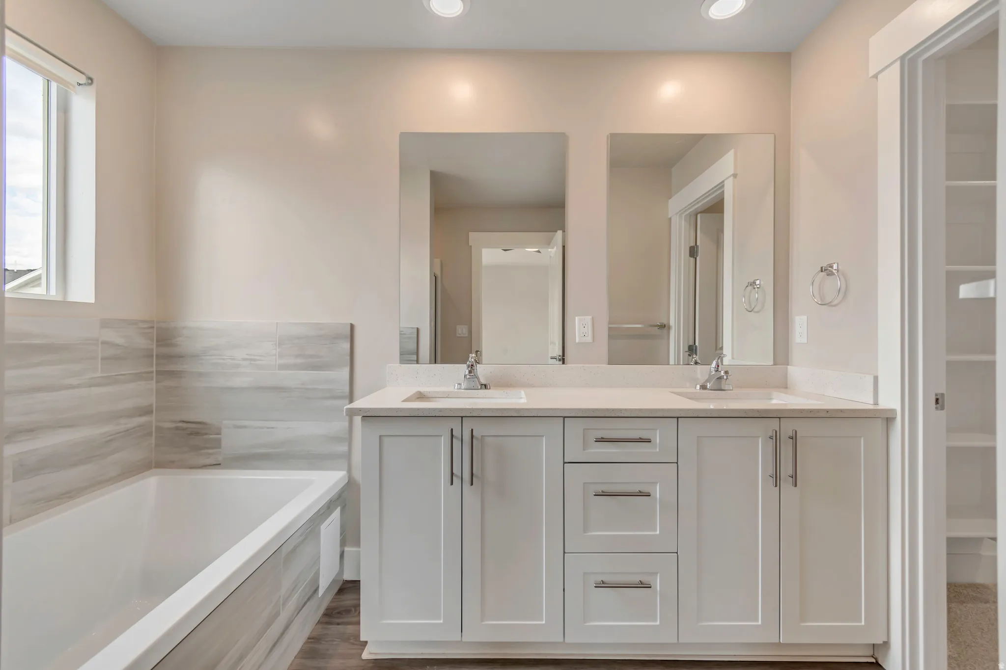 Bathroom of primary bedroom with dual sink vanity.