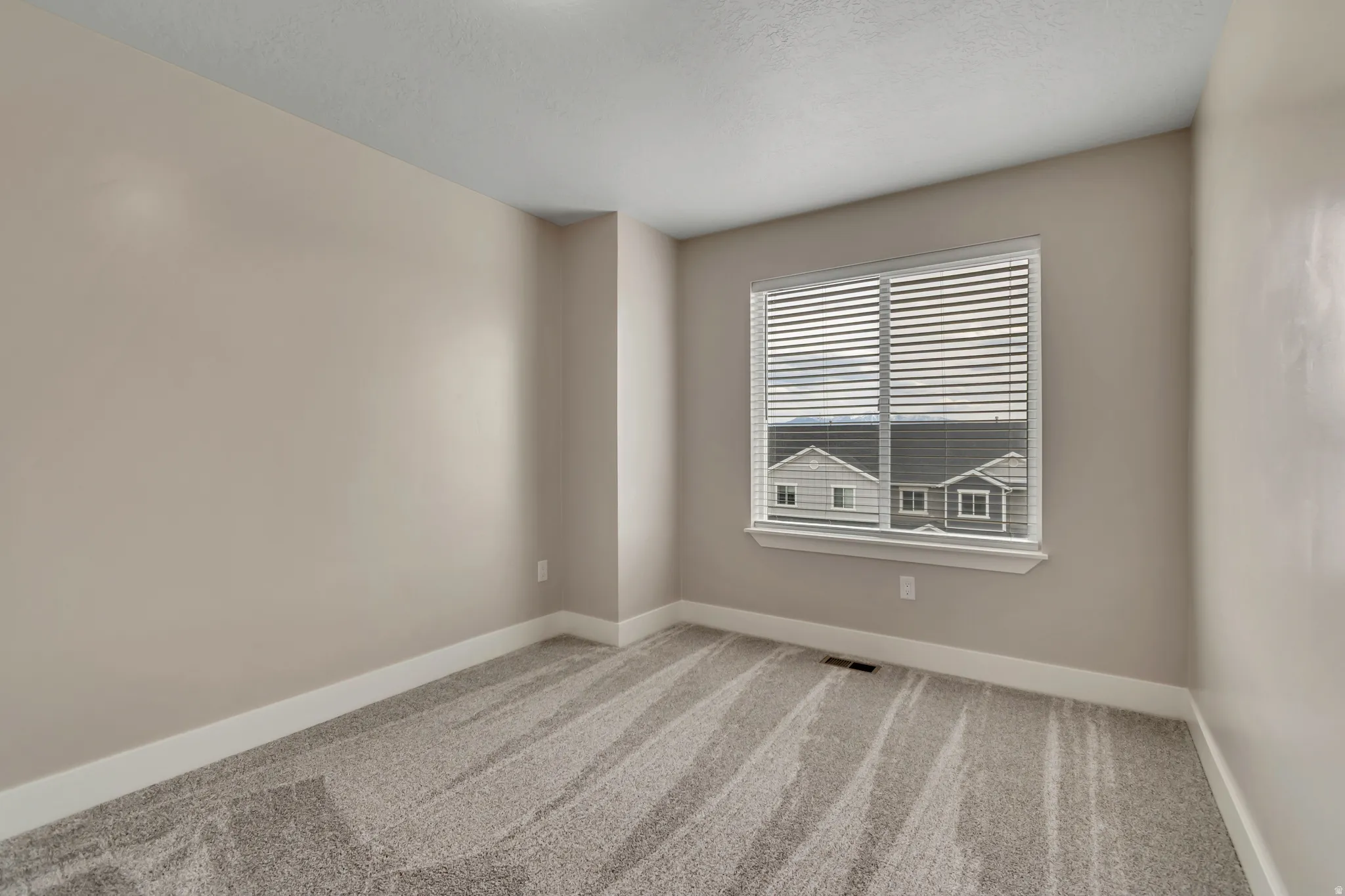 Bedroom #4 with new carpet and paint.