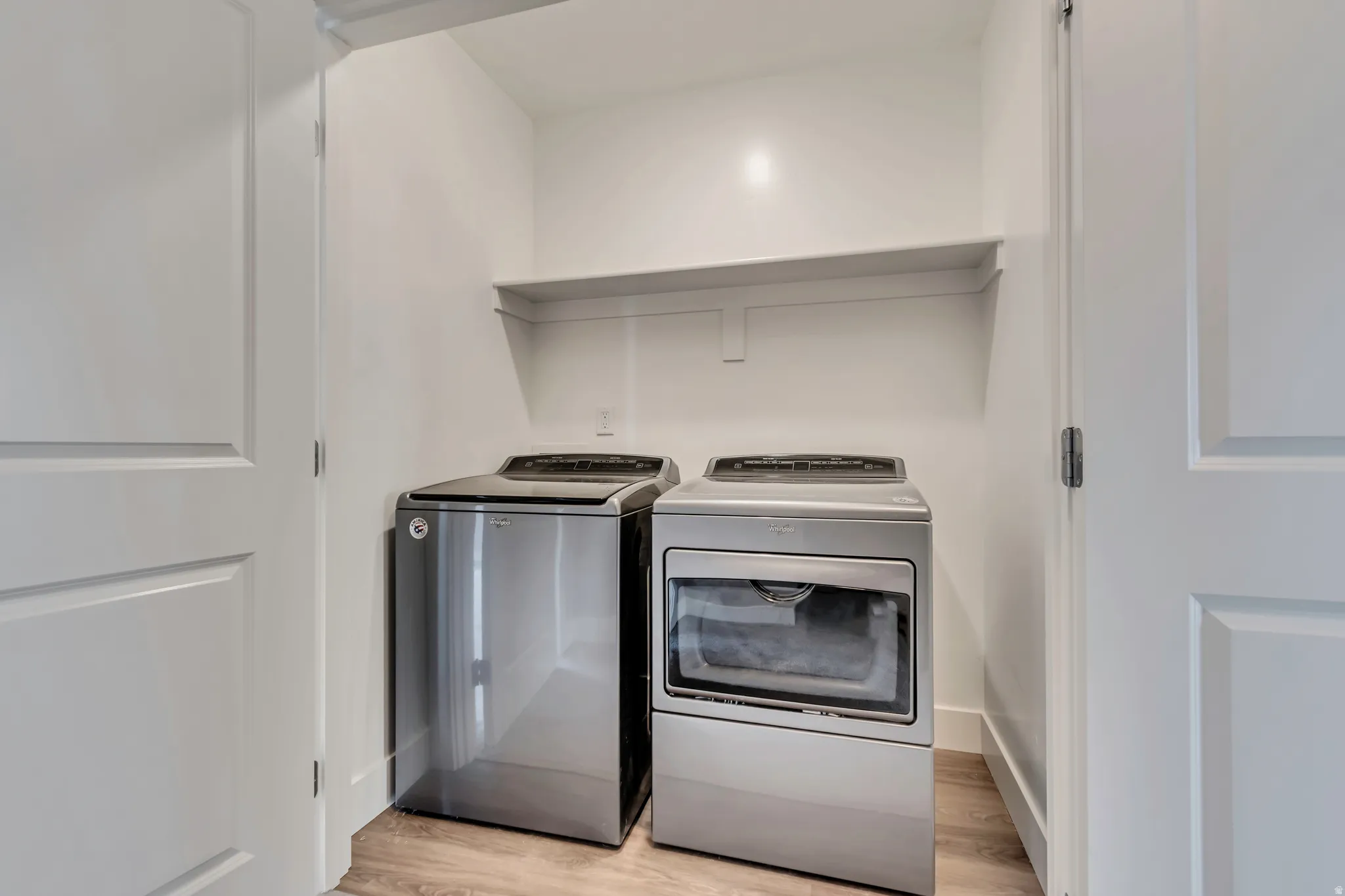 Laundry room with included washer and dryer.