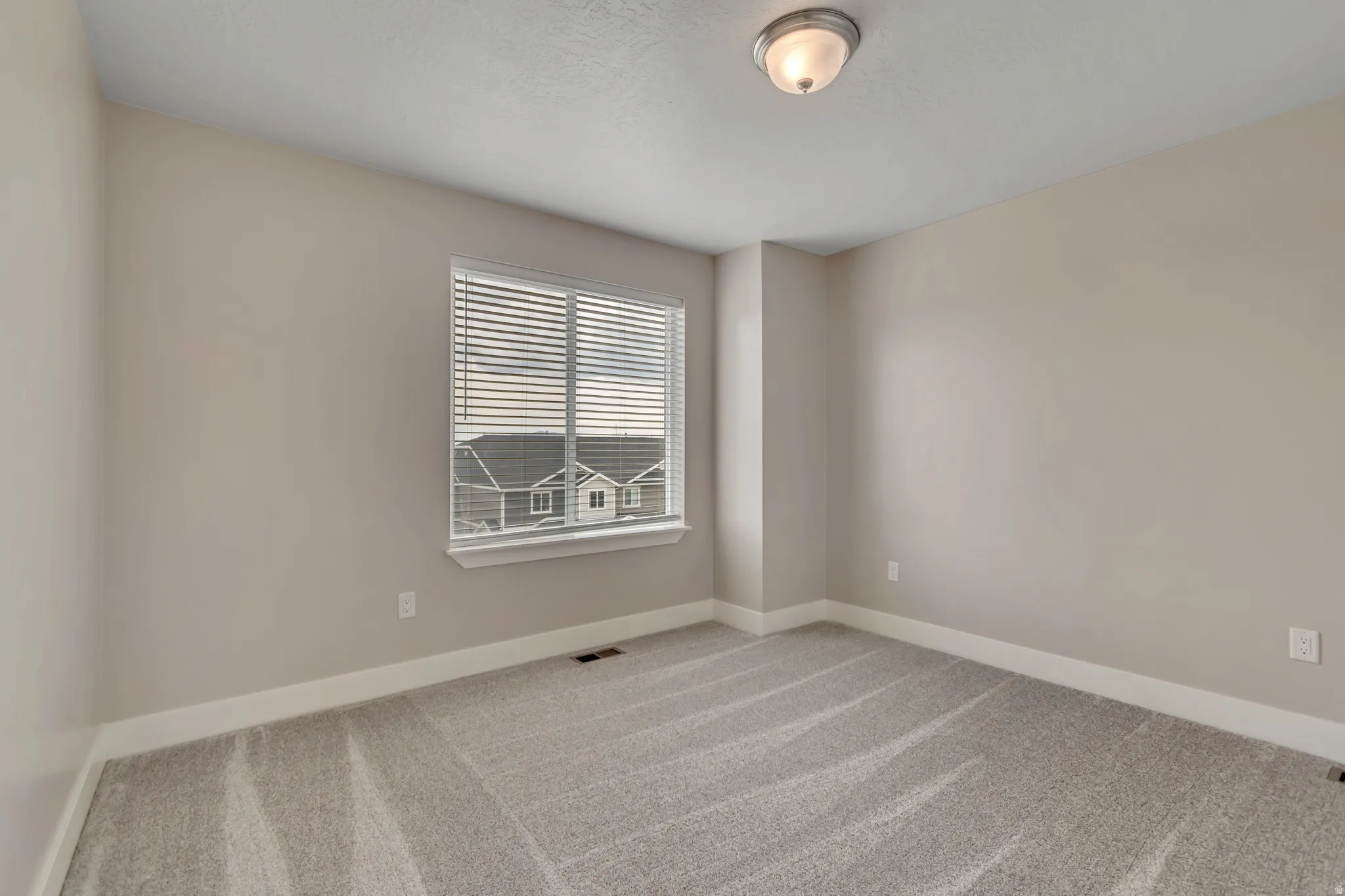 Bedroom #3 with new carpet and paint.
