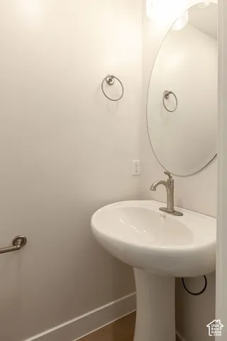 Bathroom with baseboards and a sink