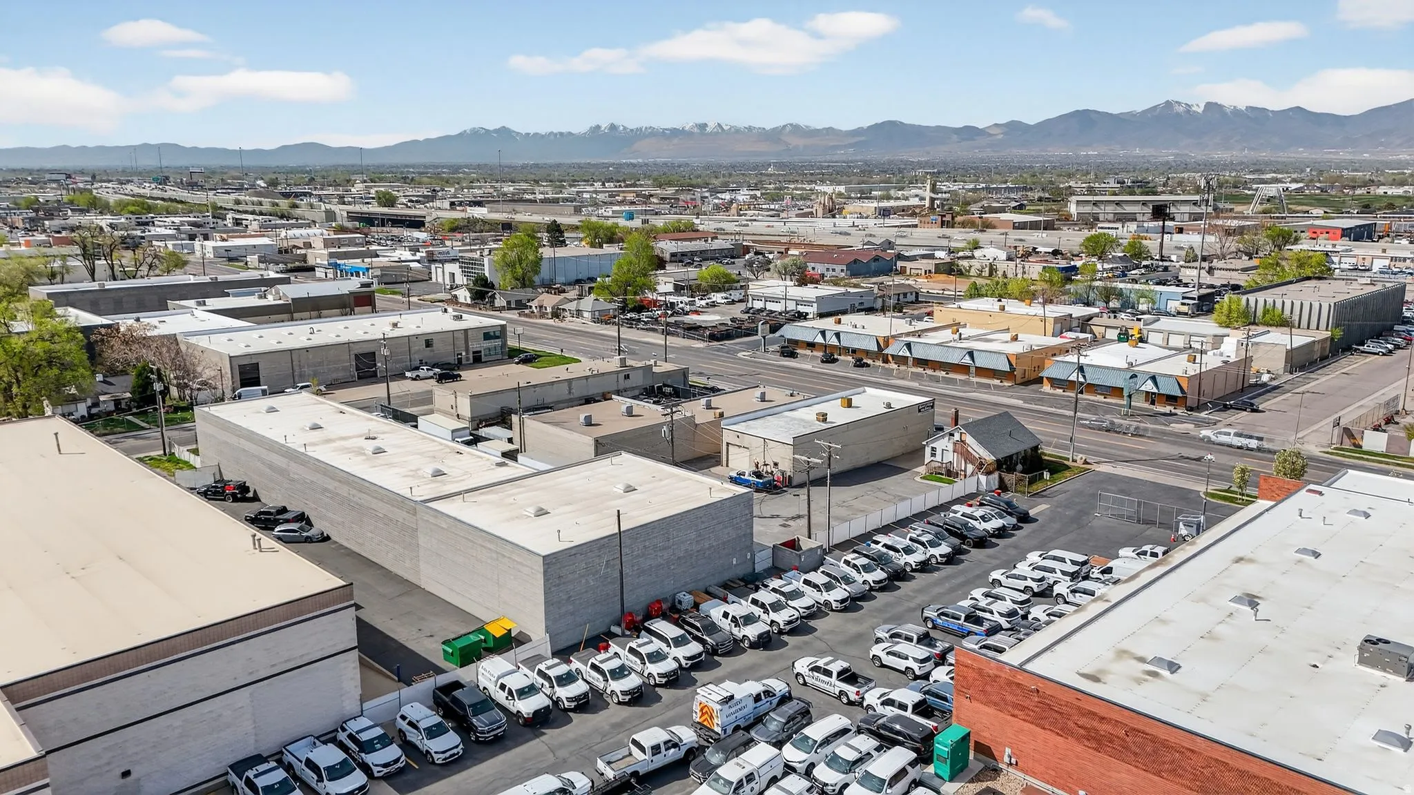 Drone / aerial view of an industrial area and mountains
