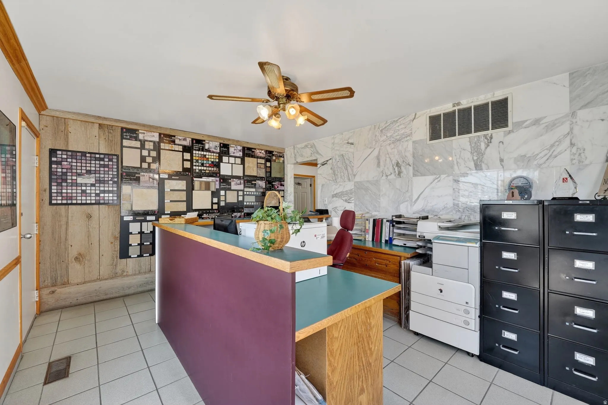 Kitchen with an office area, ceiling fan, and light tile patterned flooring
