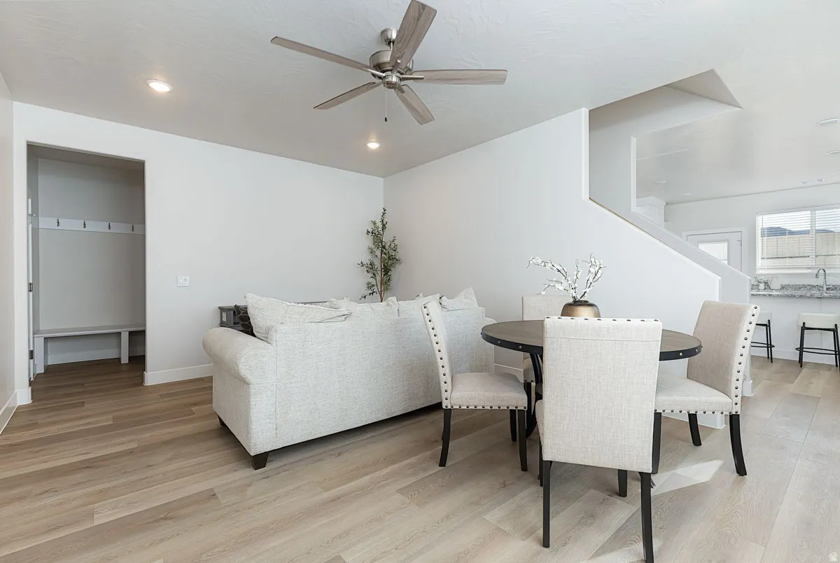Dining room featuring ceiling fan, light wood-type flooring, and recessed lighting