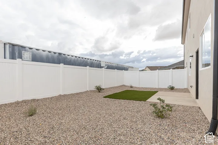 Fenced backyard with a patio area