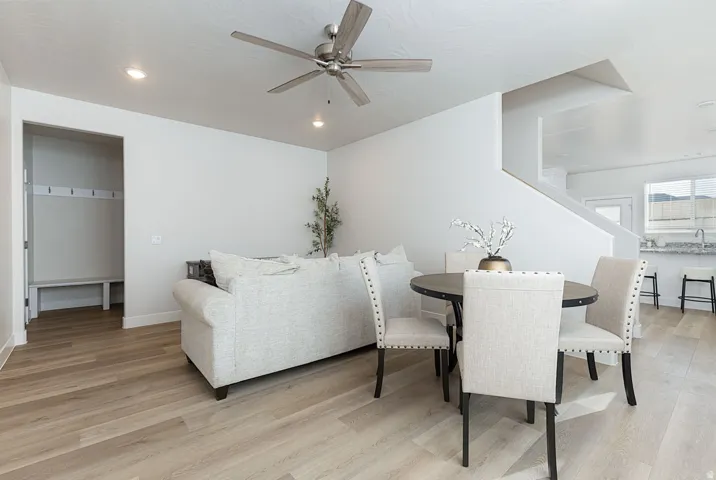 Dining room featuring ceiling fan, light wood-type flooring, and recessed lighting