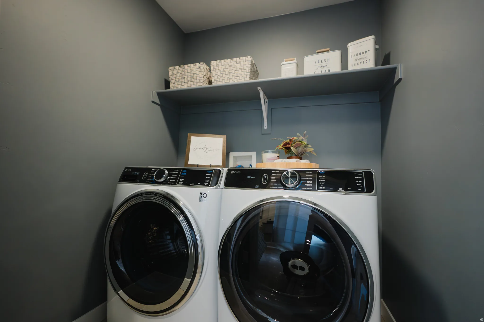 Laundry area featuring washing machine and clothes dryer