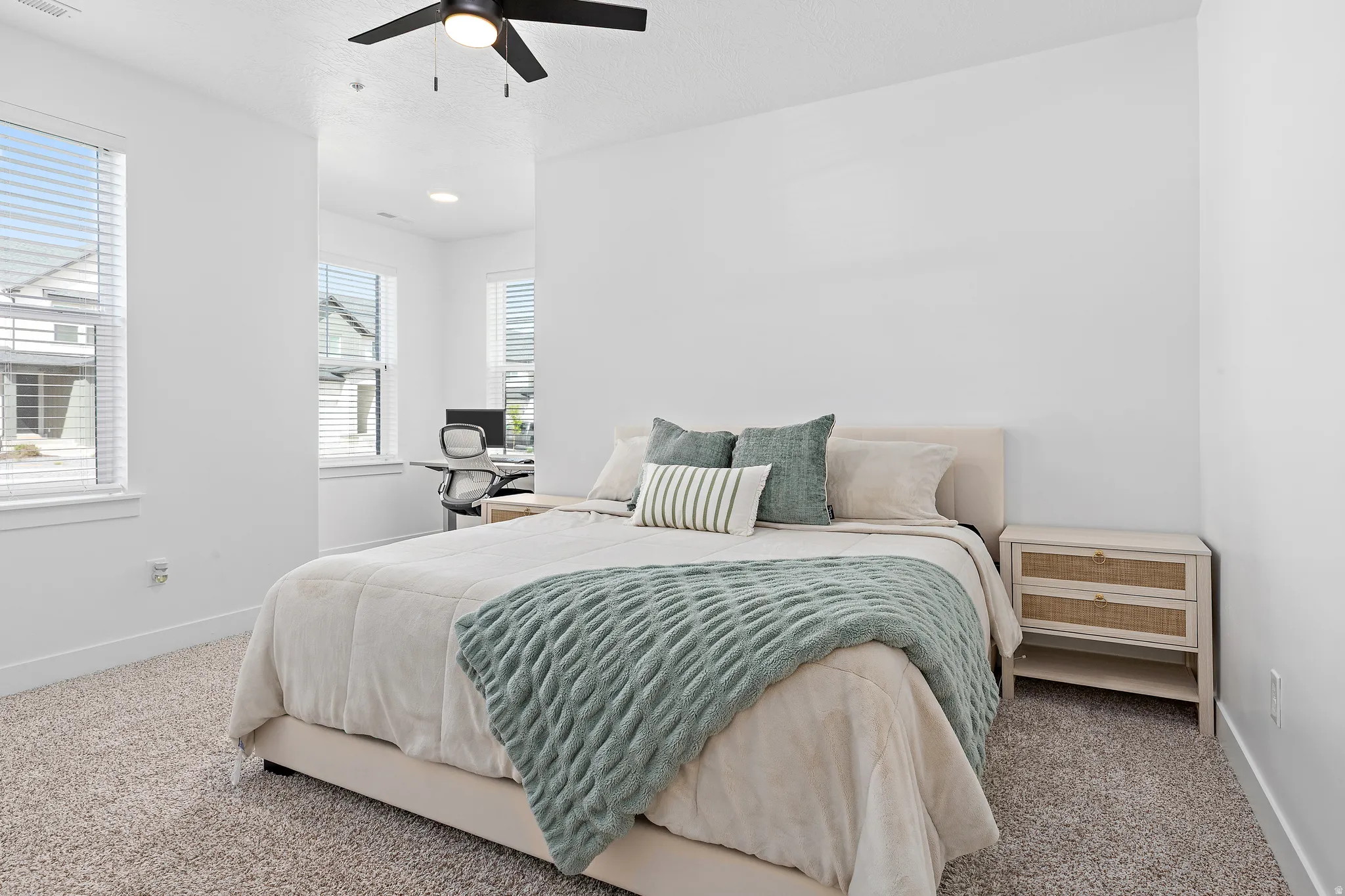 Bedroom with carpet floors and a ceiling fan
