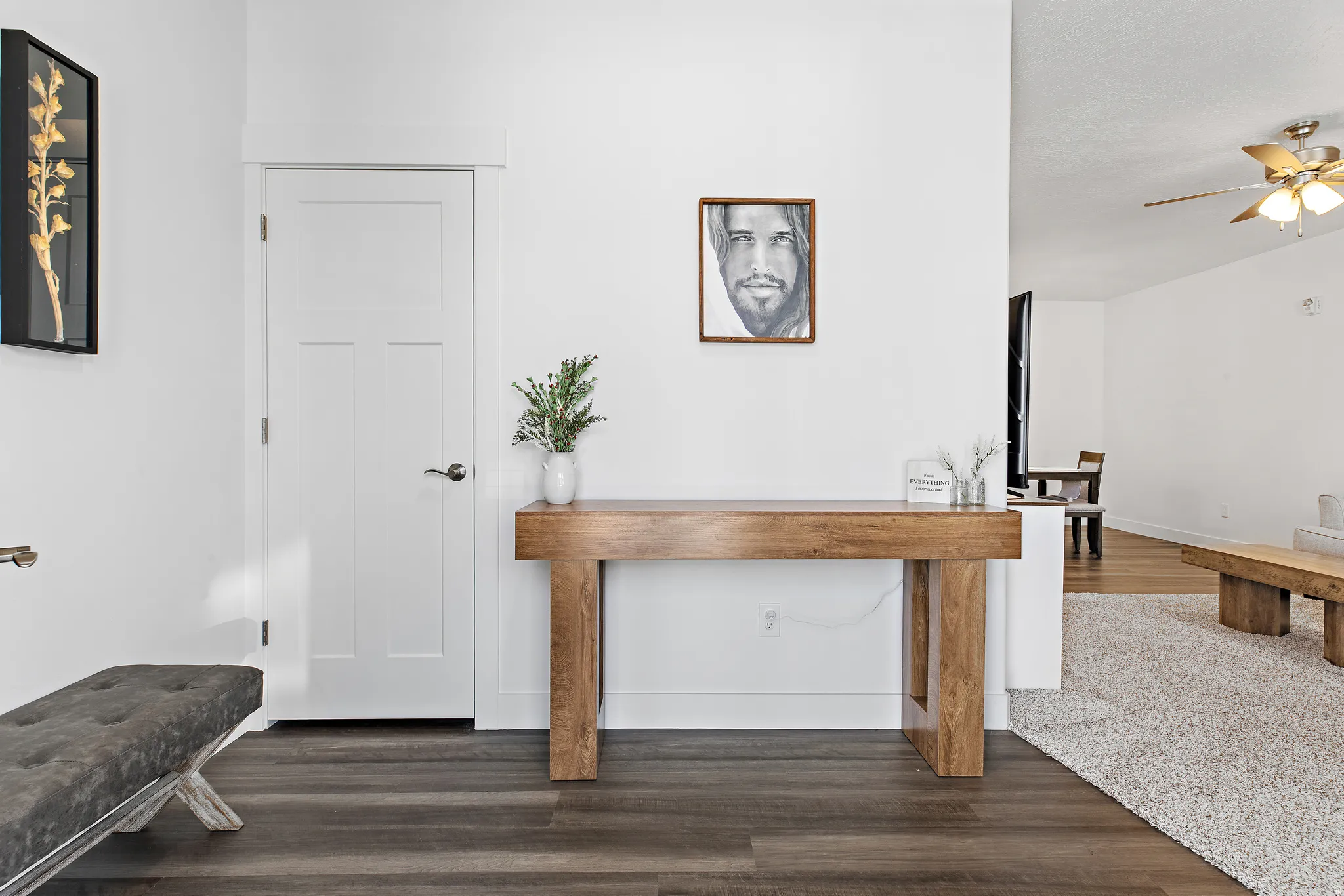 Entrance foyer featuring dark wood-style flooring and ceiling fan