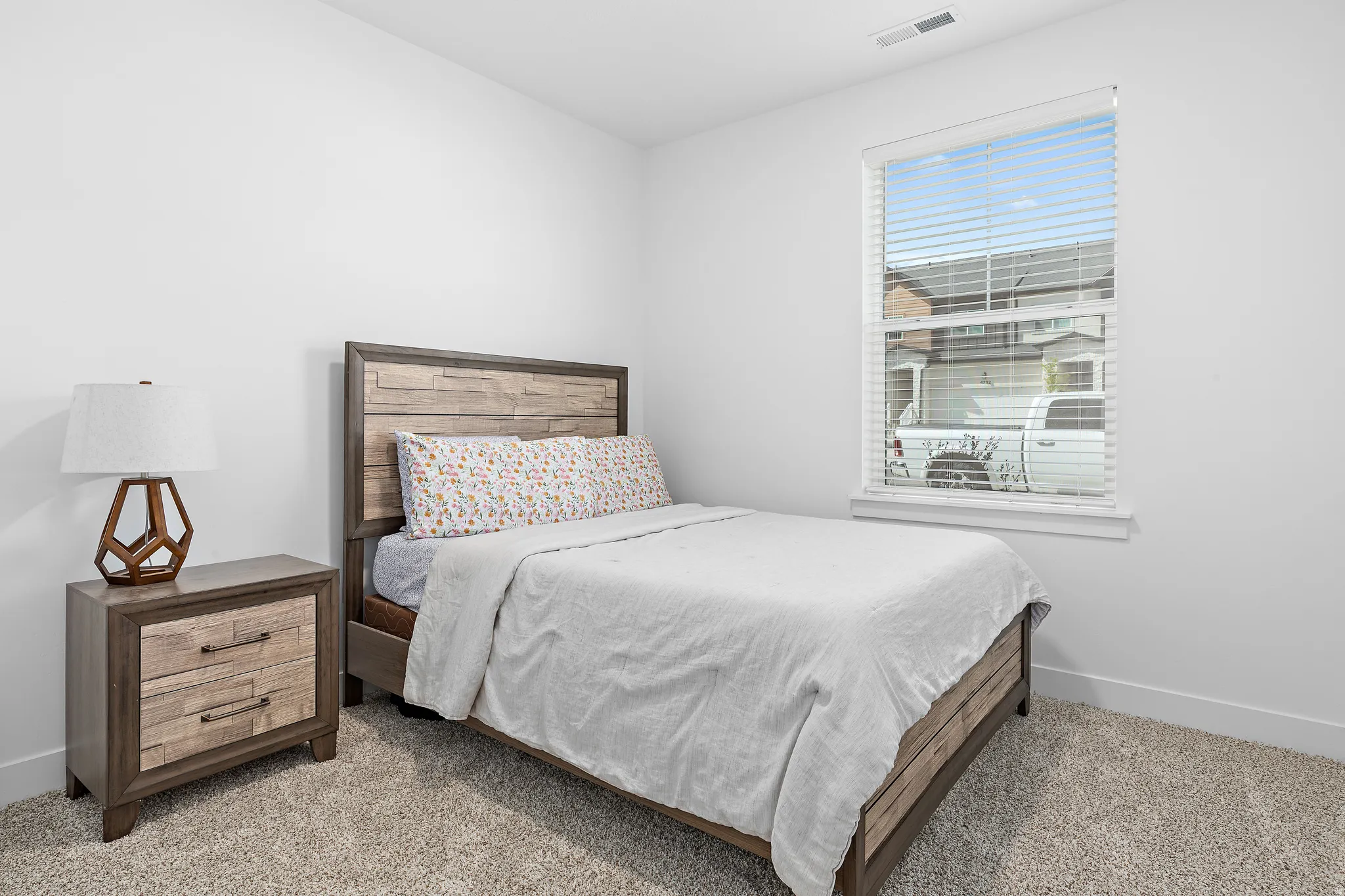 Bedroom featuring baseboards and carpet