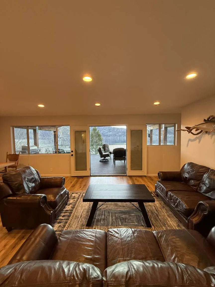 Living room featuring wood finished floors and recessed lighting