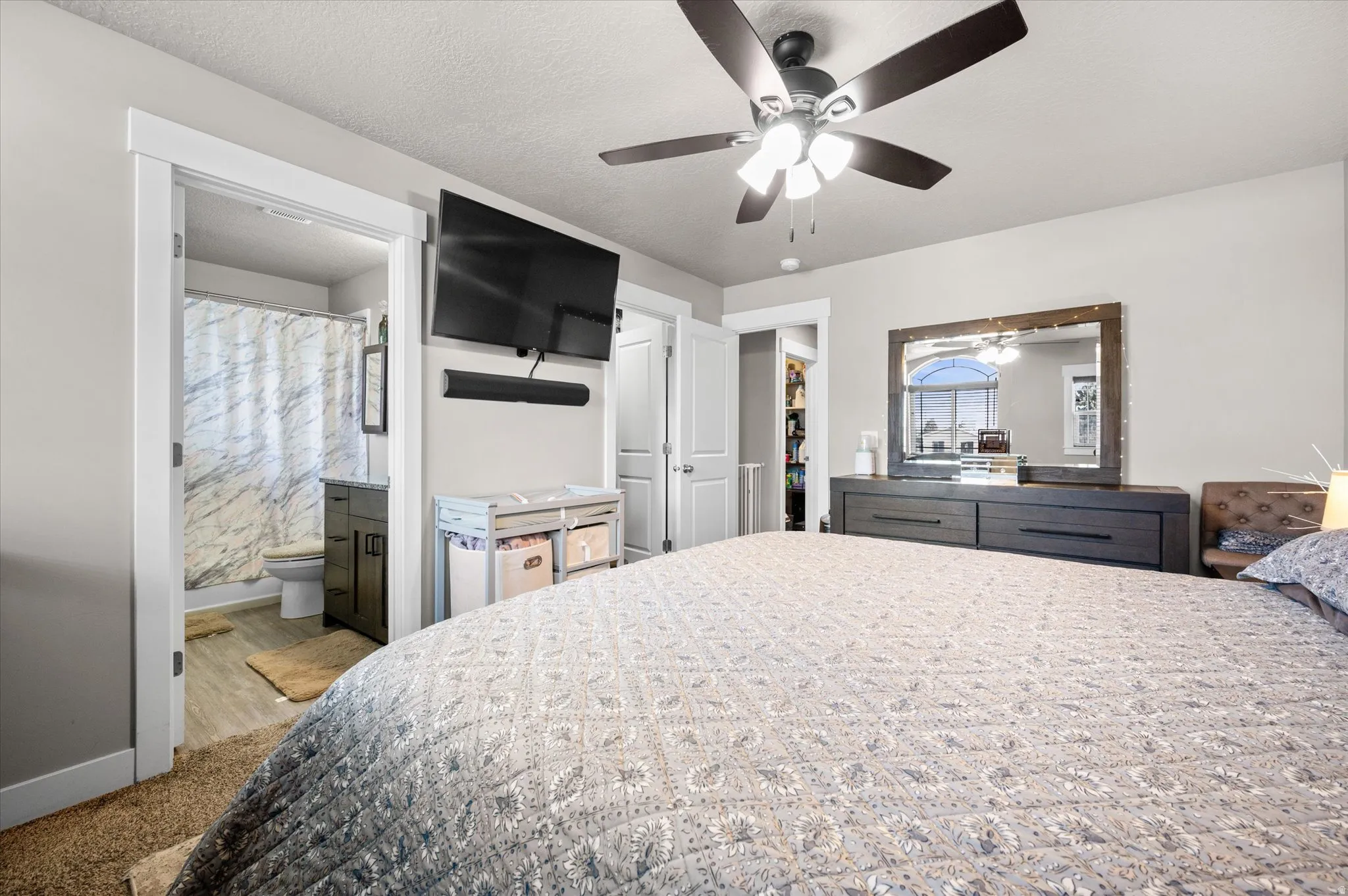 Owner's suite featuring attached full bathroom, lots of natural light, and walk in closet.