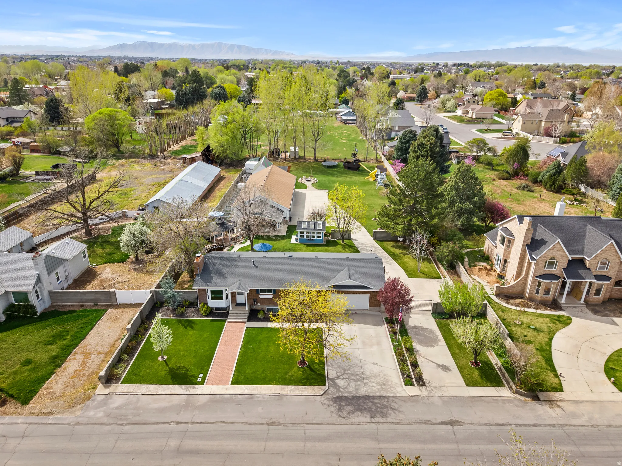Aerial perspective of suburban area featuring a mountainous background