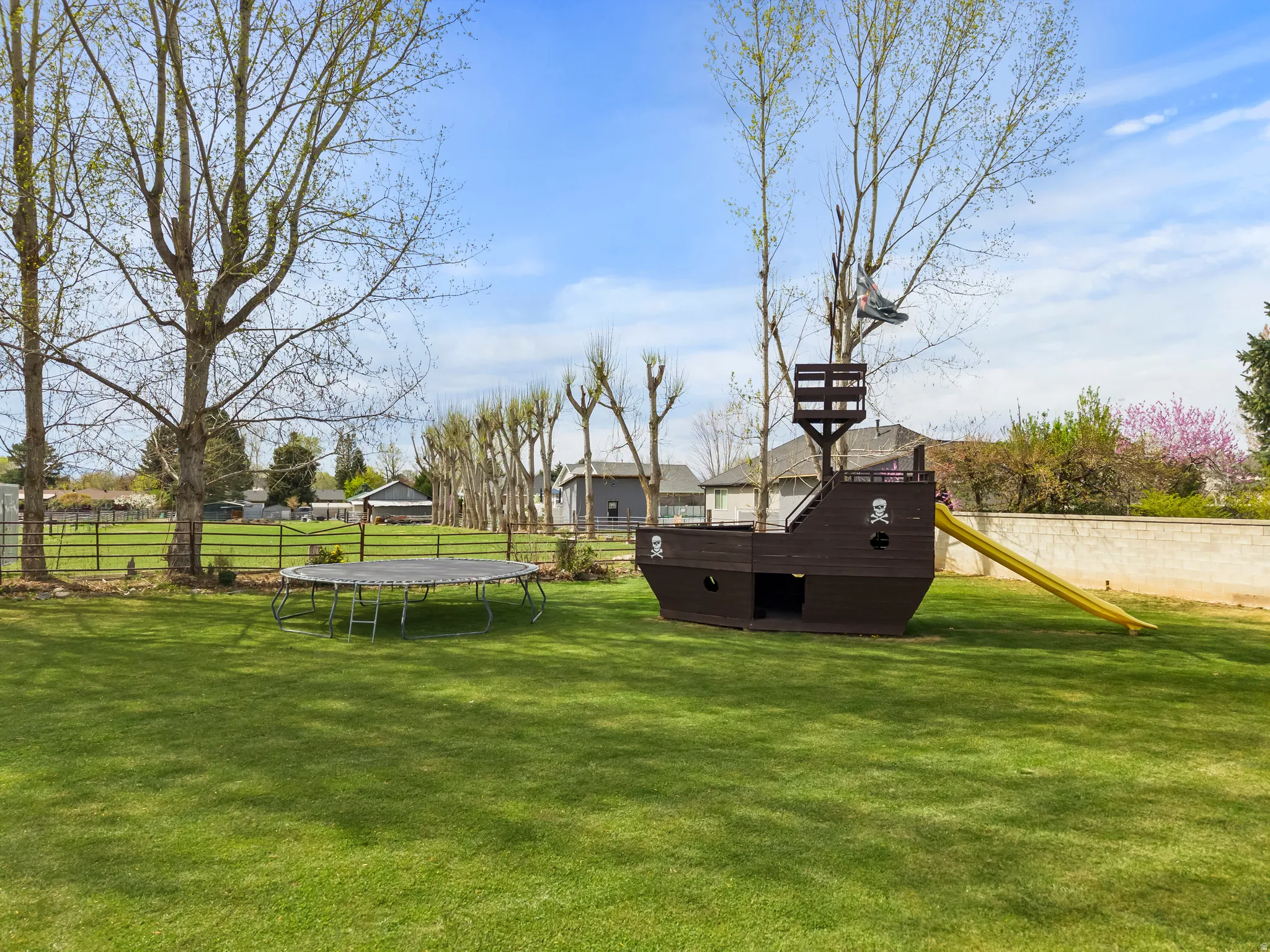 View of playground with a trampoline