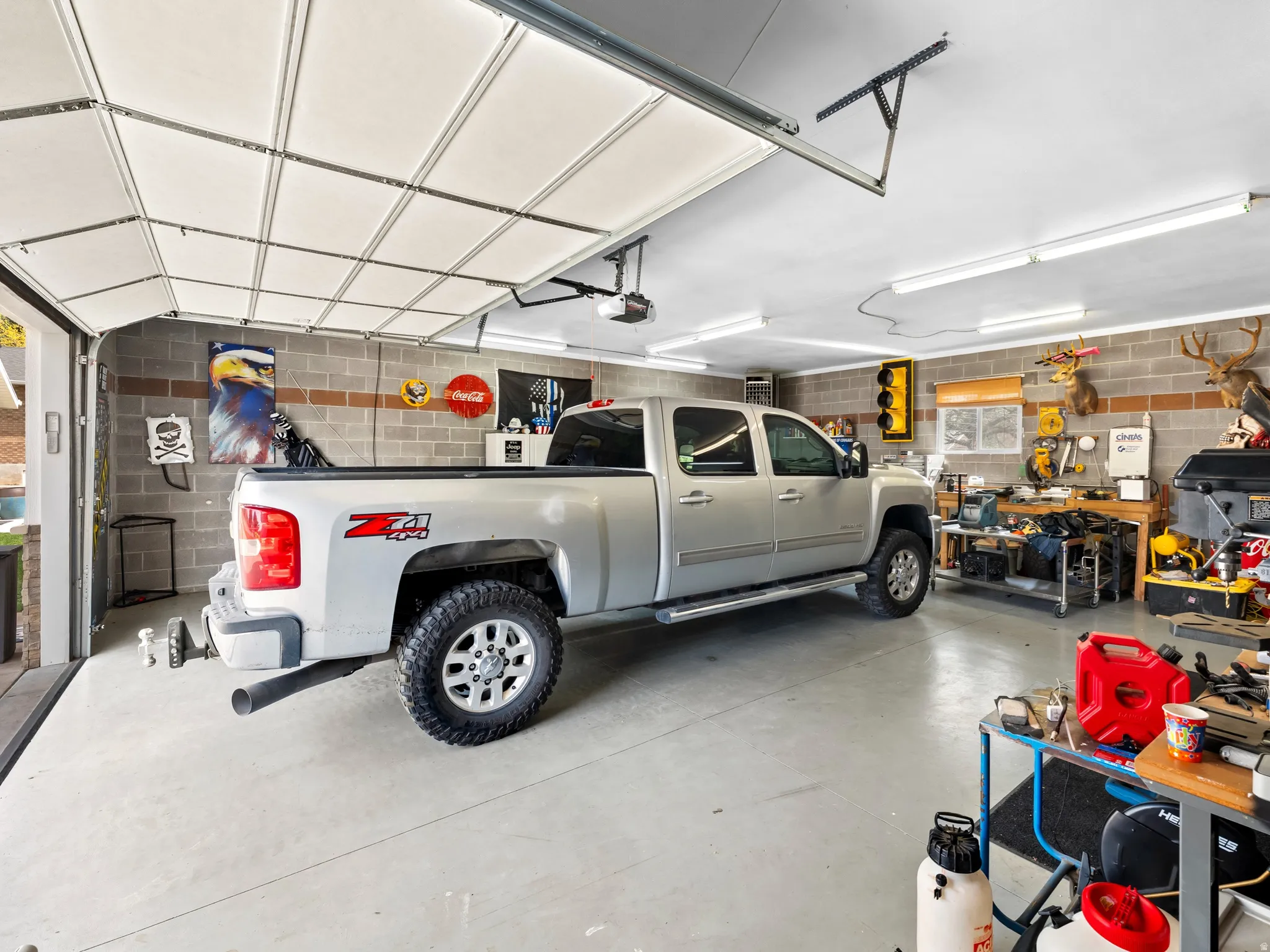 Garage featuring concrete block wall