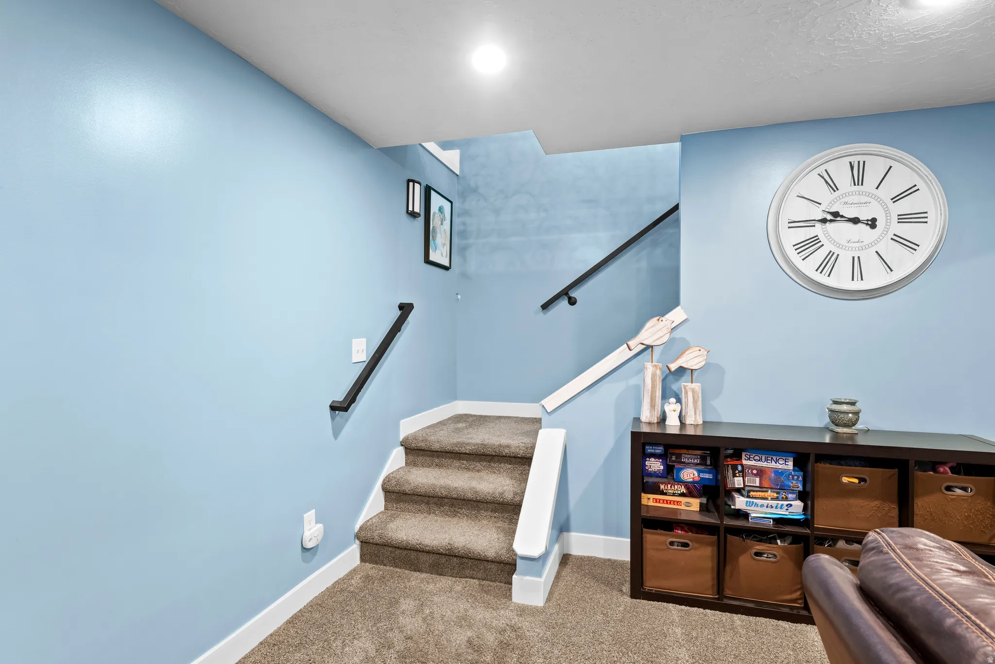 Stairway featuring carpet and baseboards