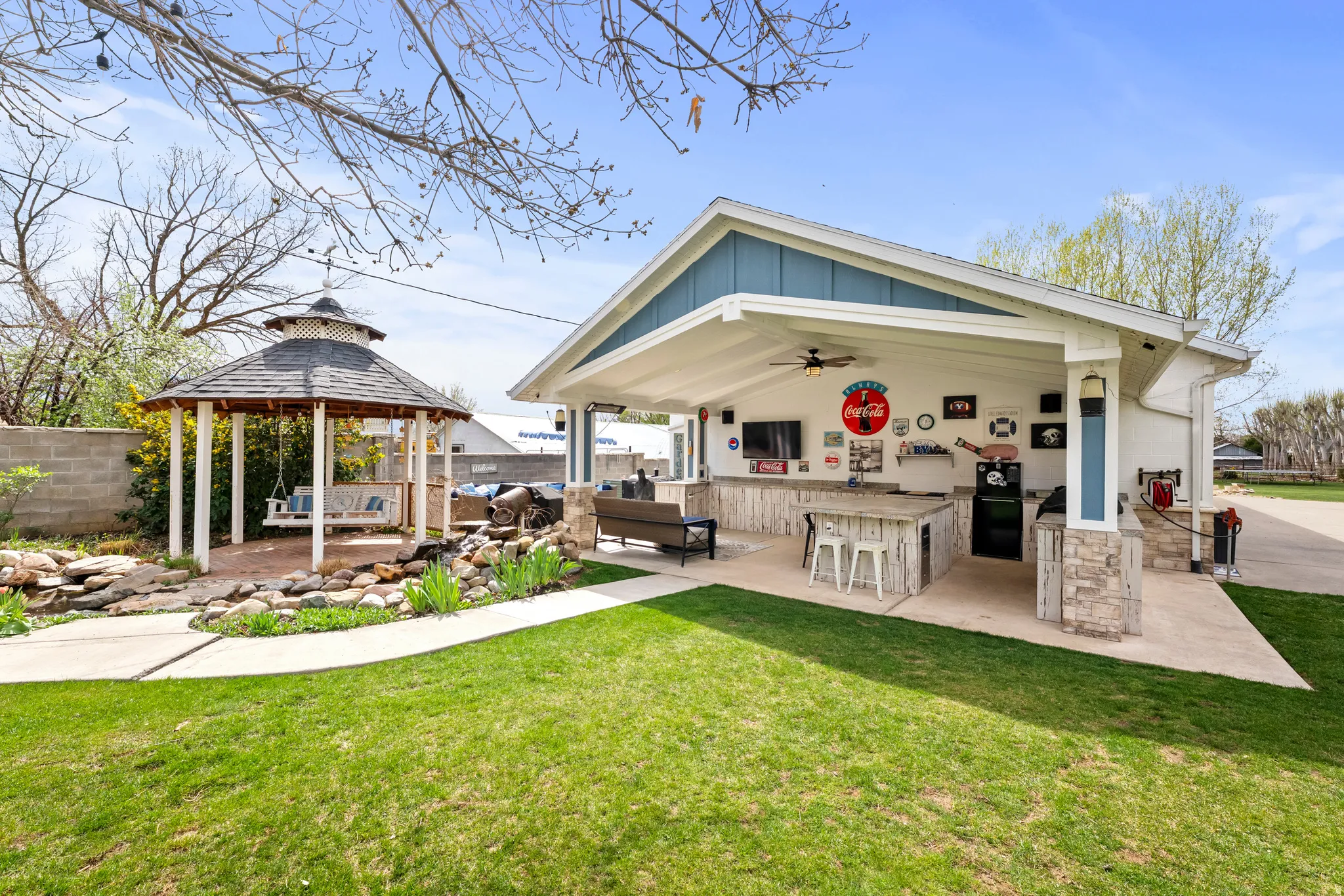 Outside kitchen.  Great for hosting game nights.  Gazebo with swing and pond area.