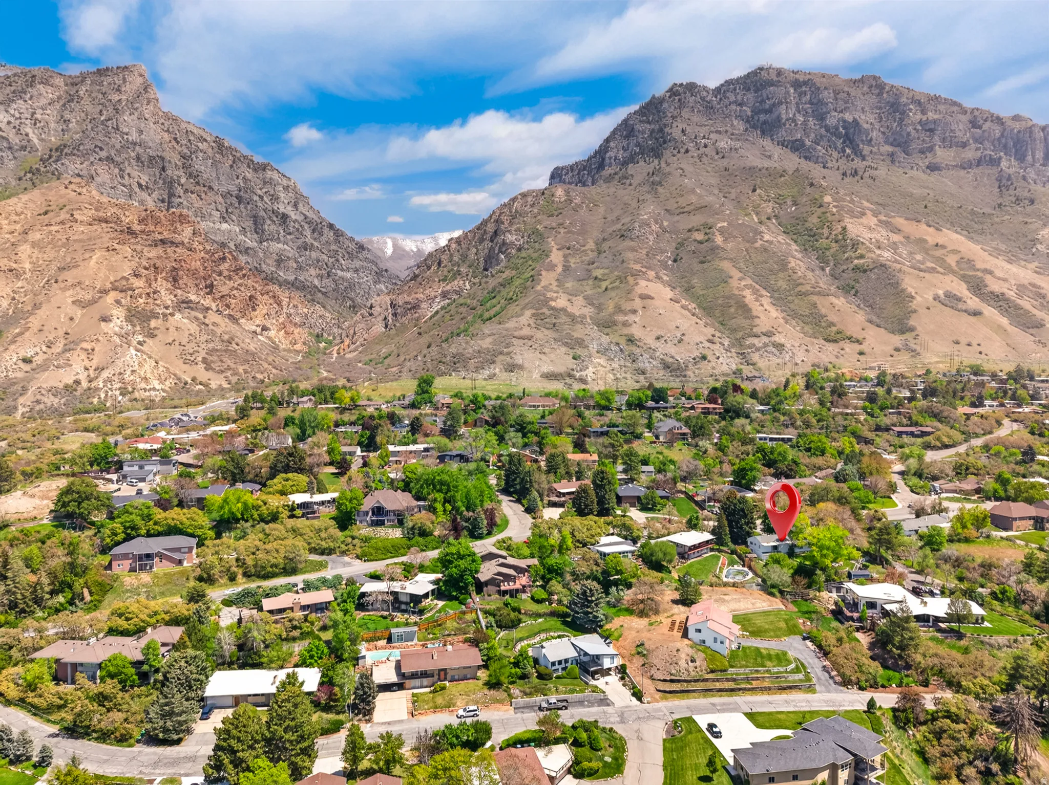 Property featuring a prominent mountain backdrop, surrounded by established residences and mature landscaping
