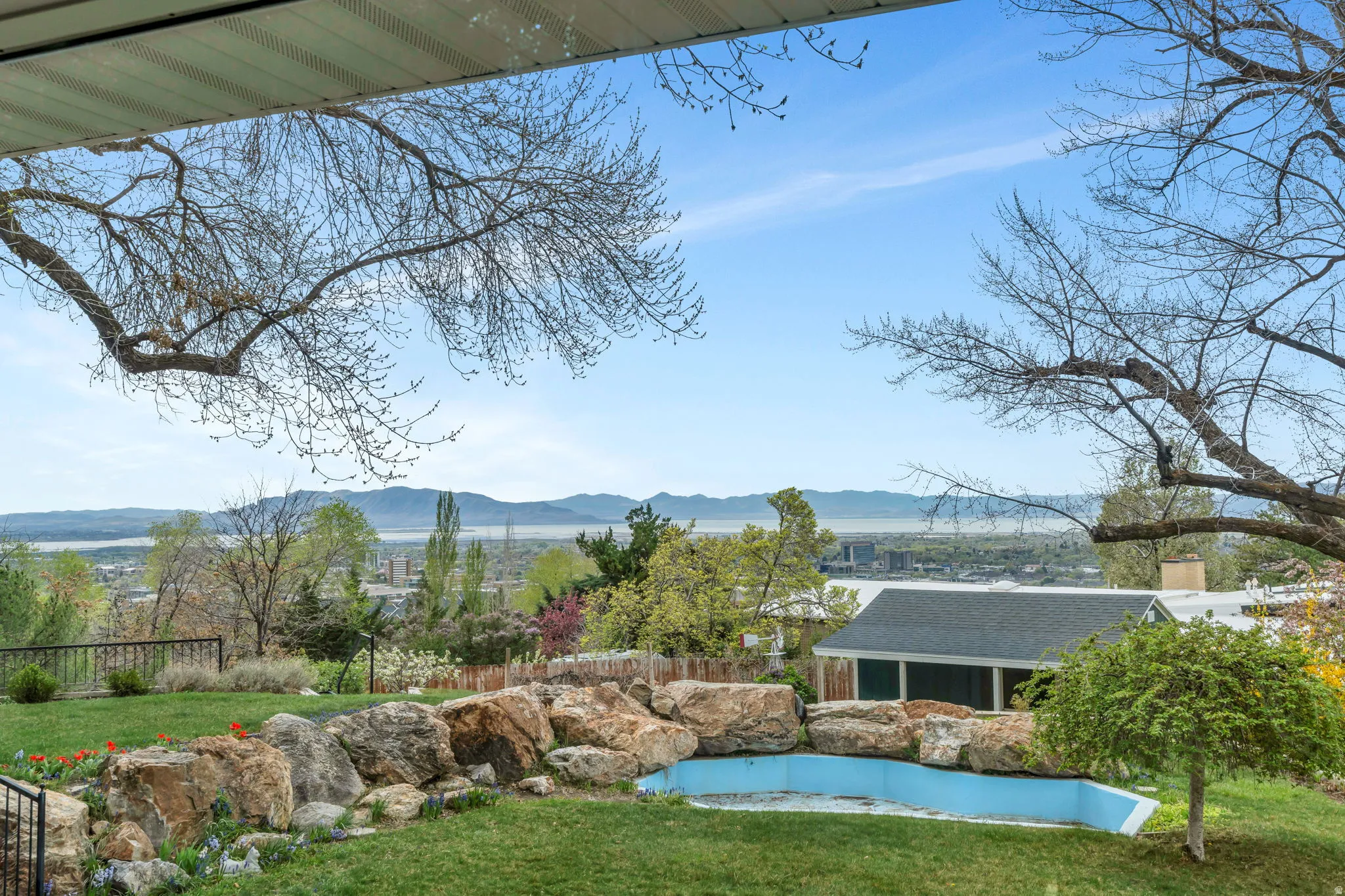 View of yard featuring a mountain view and an outdoor structure