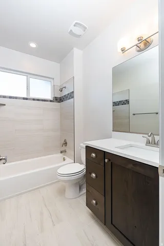 Bathroom featuring vanity and shower / bathtub combination