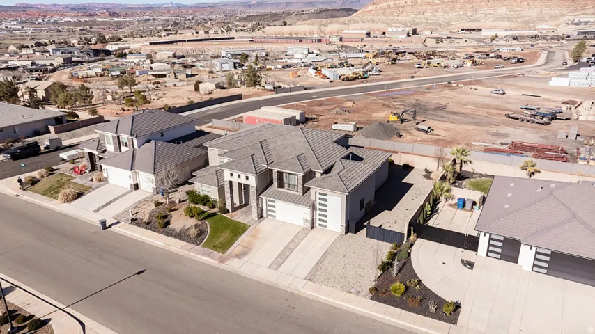Aerial perspective of suburban area with a mountain backdrop