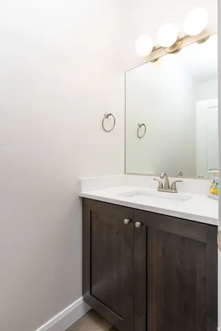 Bathroom featuring vanity and light wood-type flooring