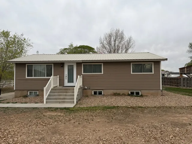 Single story home with a metal roof