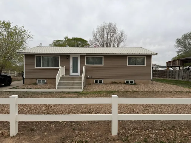 Ranch-style home with a metal roof